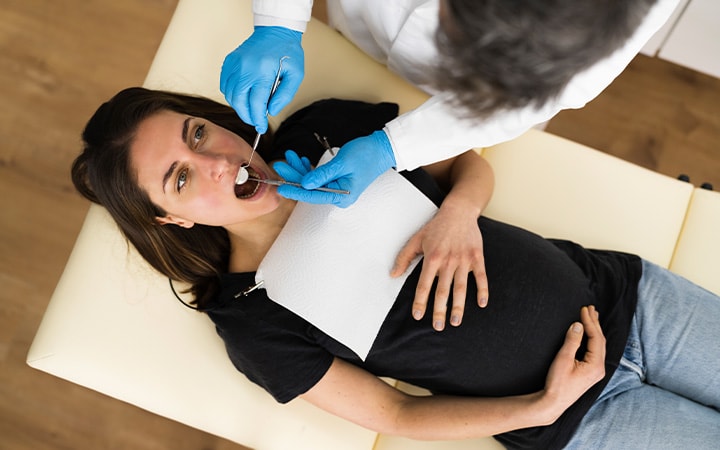 A pregnant woman at her regular dental checkup