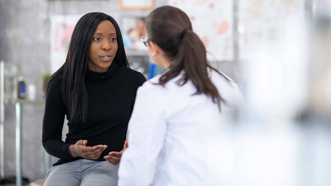 woman talking with physician